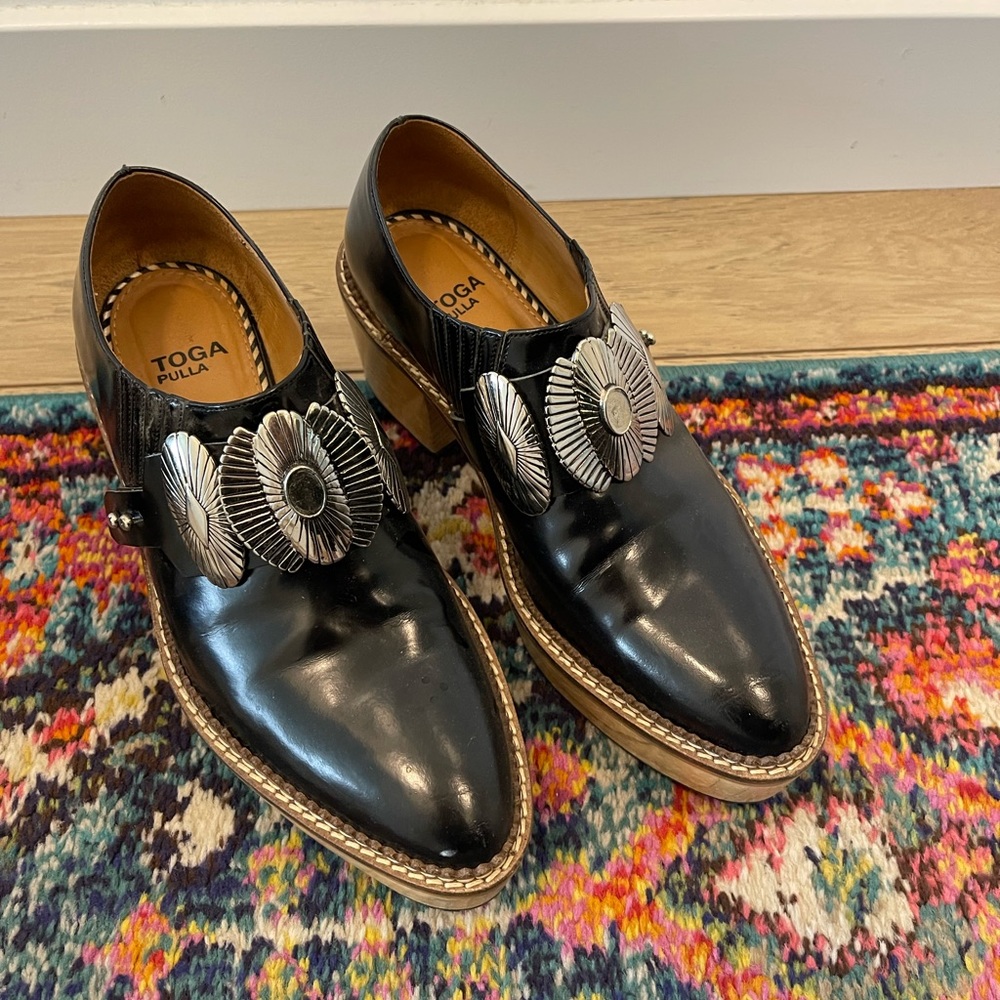 TOGA Pulla Black Leather Platform Slip-On Shoes with Silver Conchos